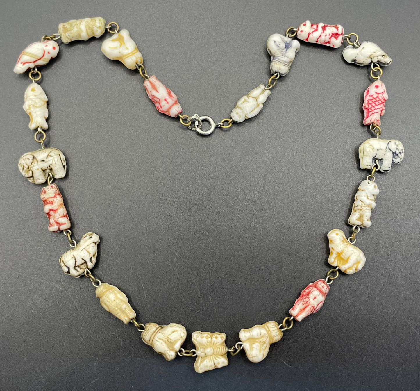 Vintage moulded 'custard' glass animal, bird, butterfly, fish & people shaped beaded necklace, rare Czech pressed glass with UV sensitivity