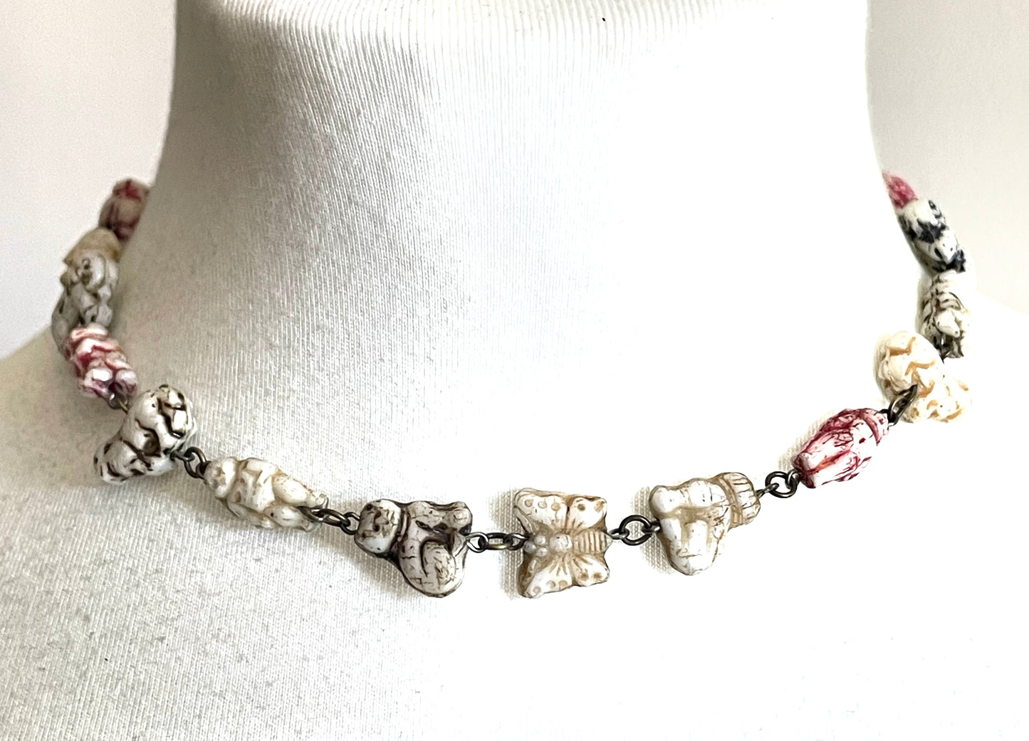 Vintage moulded 'custard' glass animal, bird, butterfly, fish & people shaped beaded necklace, rare Czech pressed glass with UV sensitivity