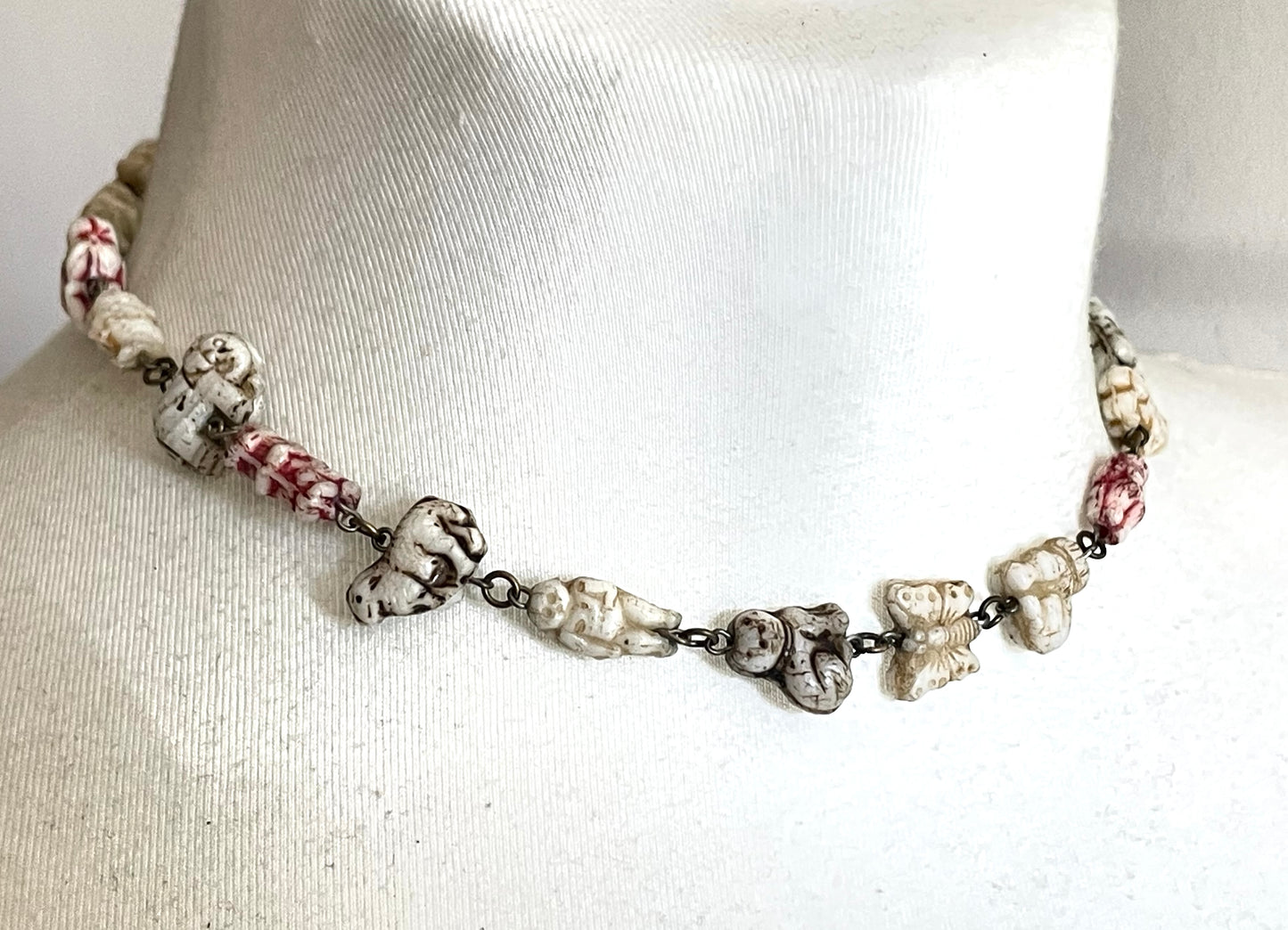 Vintage moulded 'custard' glass animal, bird, butterfly, fish & people shaped beaded necklace, rare Czech pressed glass with UV sensitivity