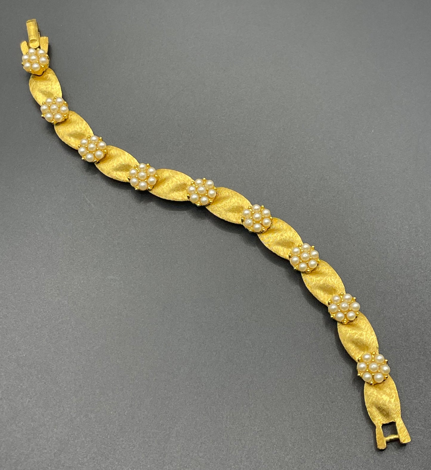 Vintage signed Trifari classic gold plated with faux pearls birthday series ribbon daisy flower panel bracelet