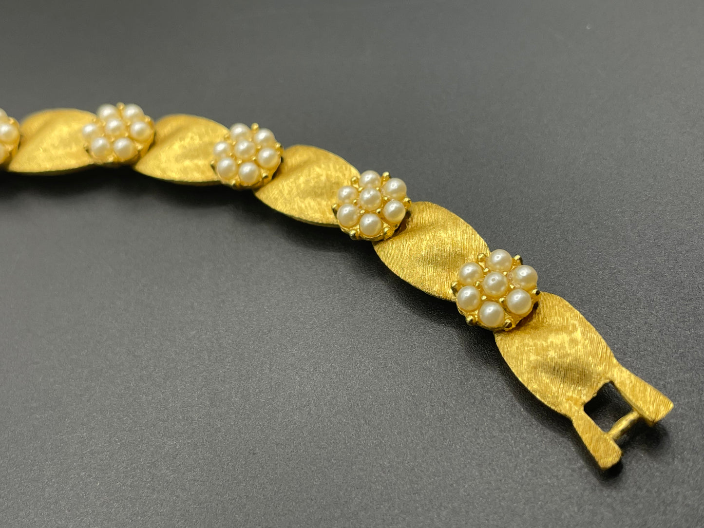 Vintage signed Trifari classic gold plated with faux pearls birthday series ribbon daisy flower panel bracelet