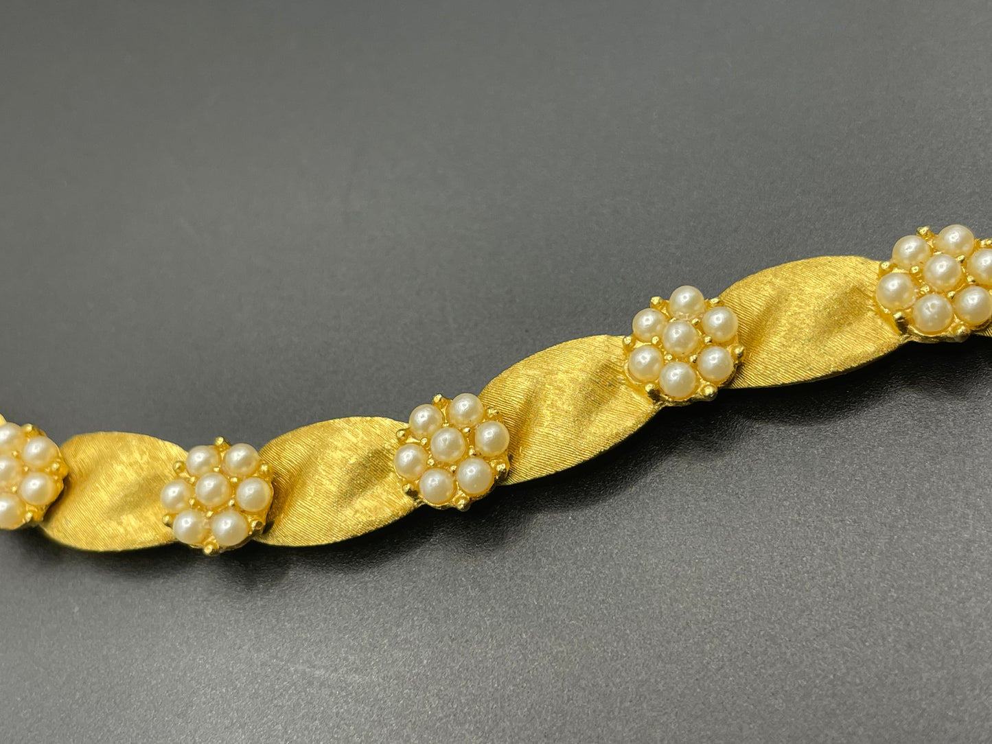 Vintage signed Trifari classic gold plated with faux pearls birthday series ribbon daisy flower panel bracelet