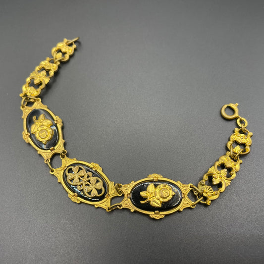 Vintage black glass and gold tone ornate floral panel bracelet in the style of Victorian mourning jewellery