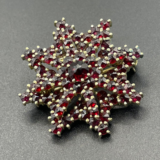 Vintage / antique Bohemian garnet floral star shaped brooch, rose cut stones set in gold tone, possibly gold, gold plated or tombac