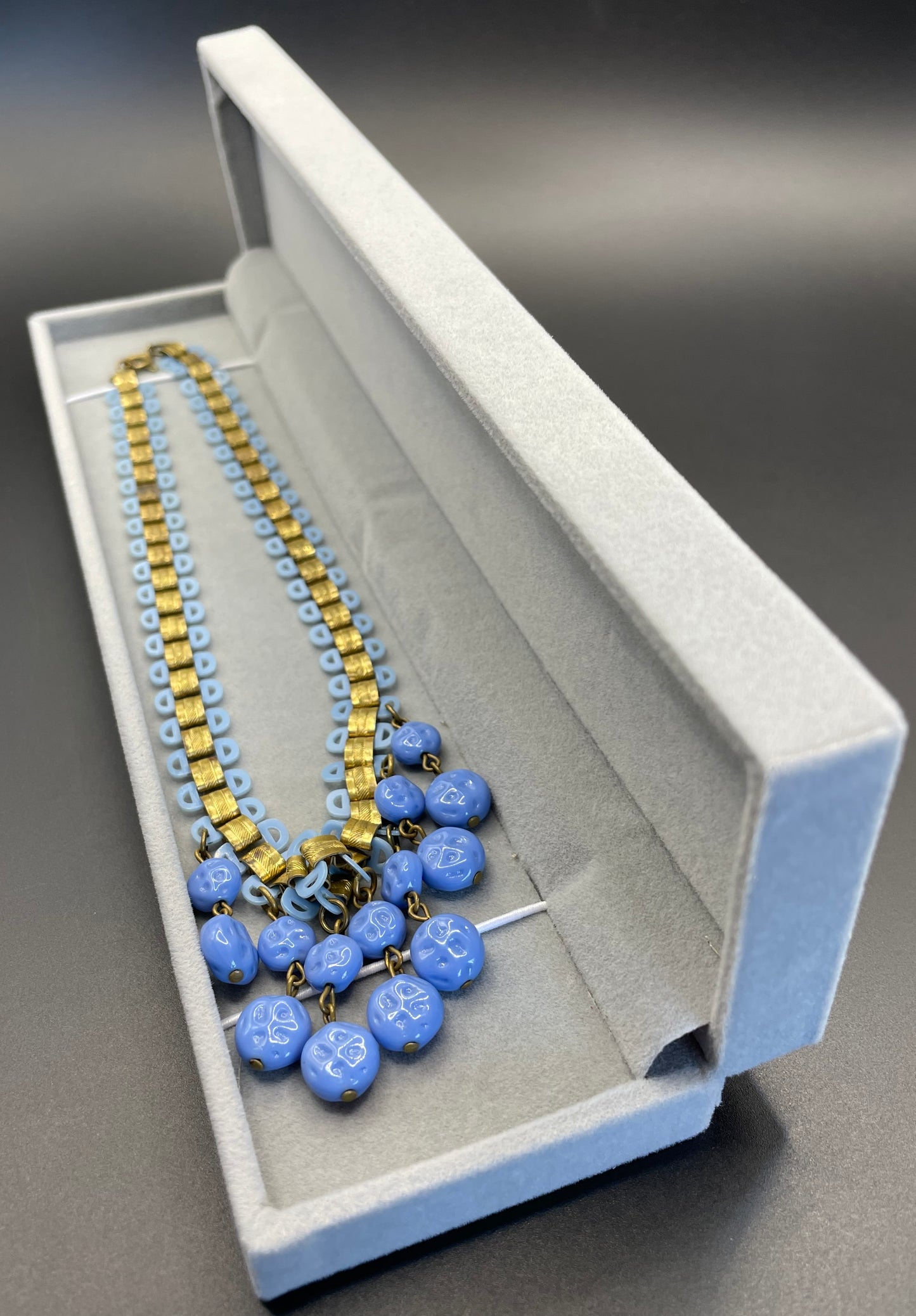 Beautiful vintage bookchain style blue poured glass bead and early plastic with gold tone fringe necklace, Art Deco, Miriam Haskell style