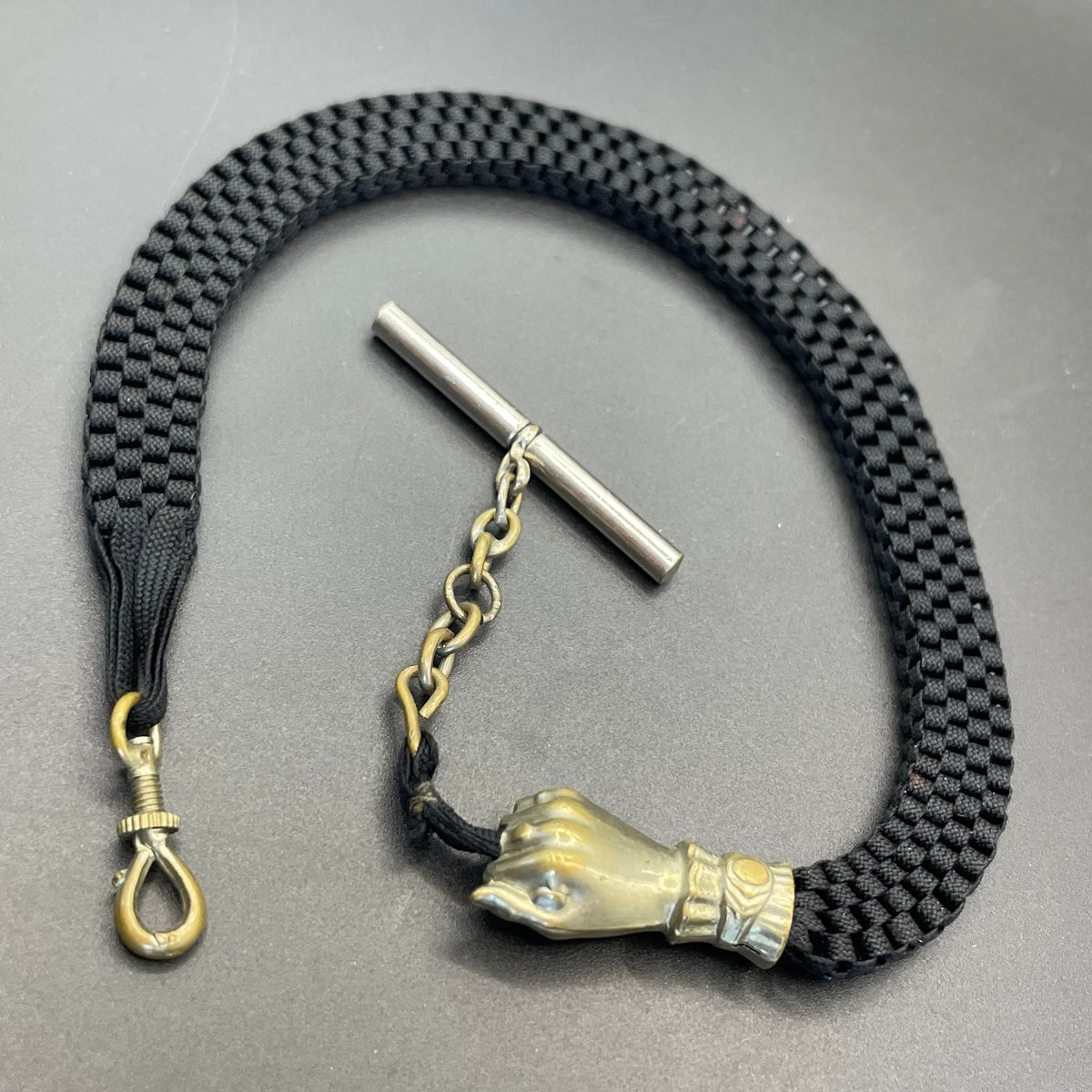 Antique Victorian black woven Abertina watch chain with hand motif and T bar