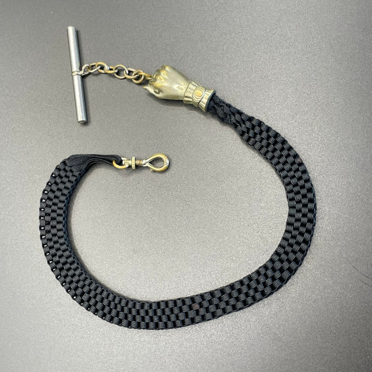 Antique Victorian black woven Abertina watch chain with hand motif and T bar