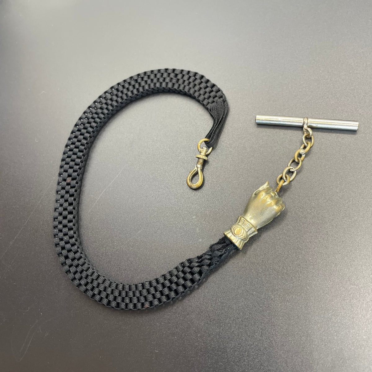 Antique Victorian black woven Abertina watch chain with hand motif and T bar