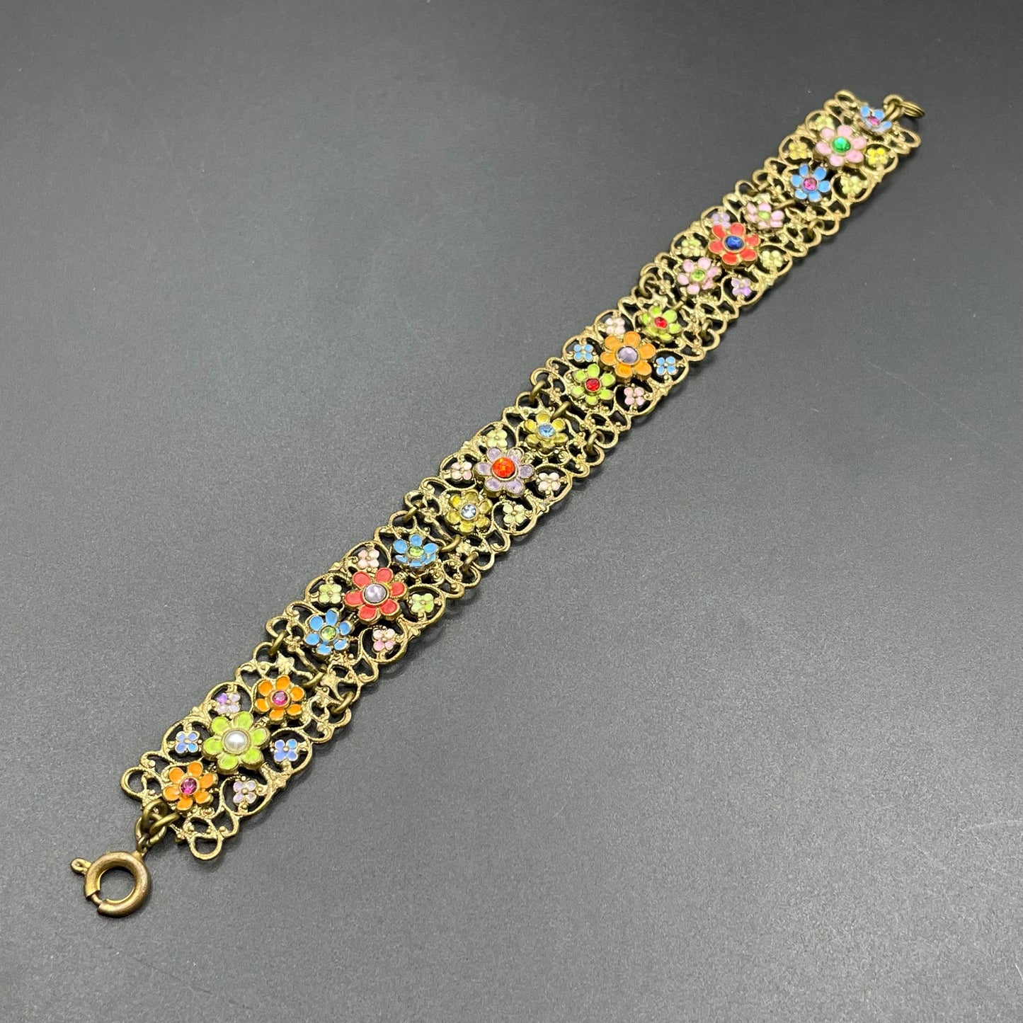 Vintage Art Deco Czech gold tone filigree, multicoloured glass rhinestone and cold painted enamel panel bracelet