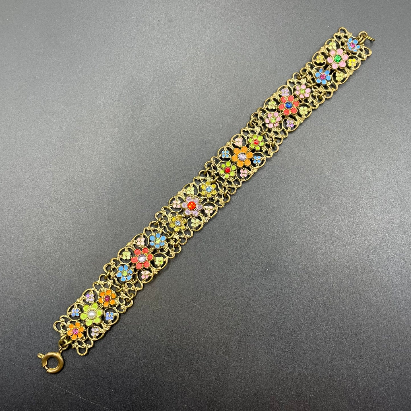 Vintage Art Deco Czech gold tone filigree, multicoloured glass rhinestone and cold painted enamel panel bracelet