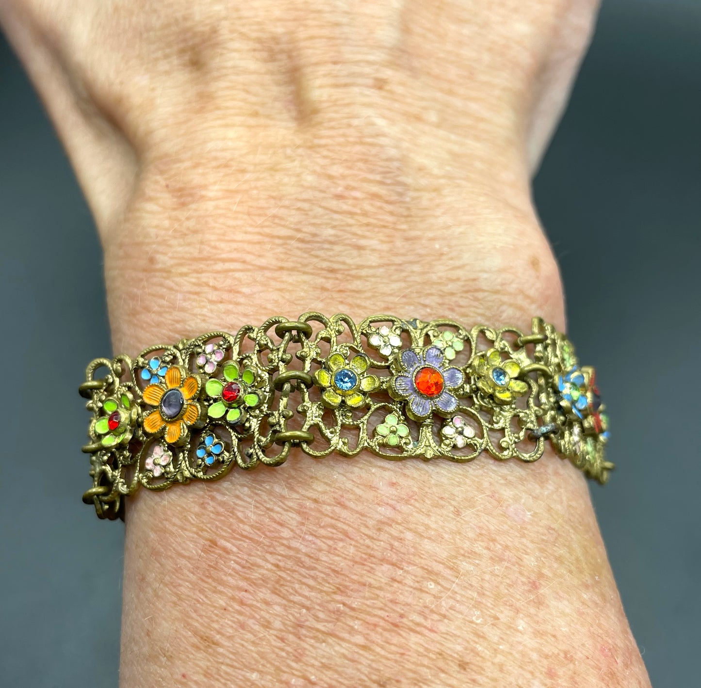Vintage Art Deco Czech gold tone filigree, multicoloured glass rhinestone and cold painted enamel panel bracelet