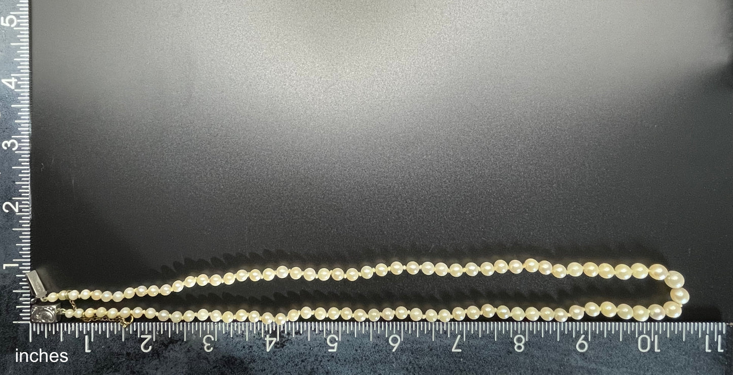 Vintage real cultured pearl necklace, graduated in size, hand-knotted, pretty engraved sterling silver clasp, mid-length
