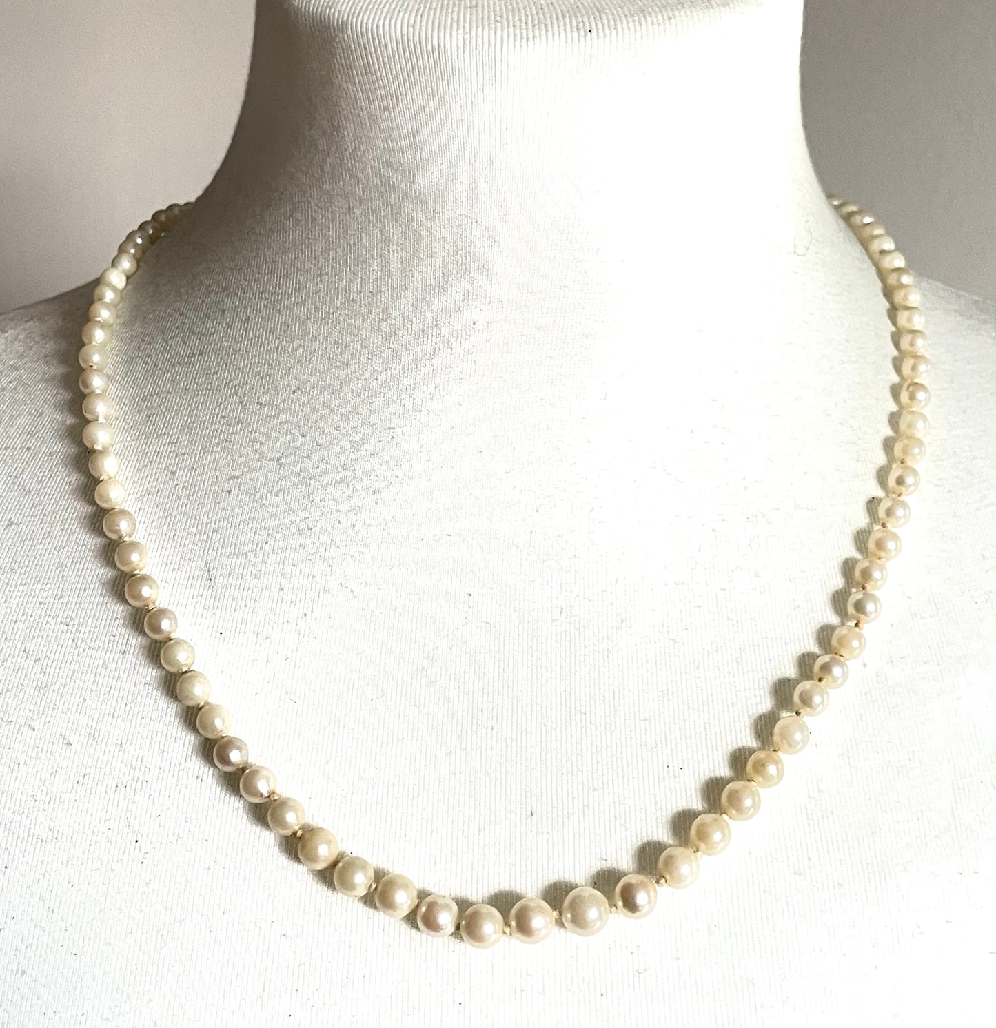 Vintage real cultured pearl necklace, graduated in size, hand-knotted, pretty engraved sterling silver clasp, mid-length