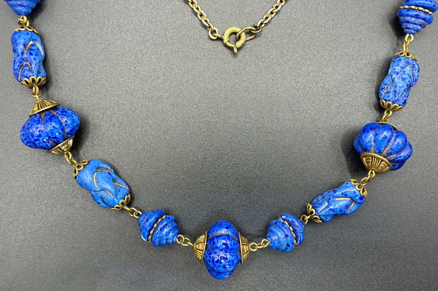 Vintage Art Deco Czech blue faux lapis lazuli glass bead necklace with beautiful moulded glass beads and gold tone filigree