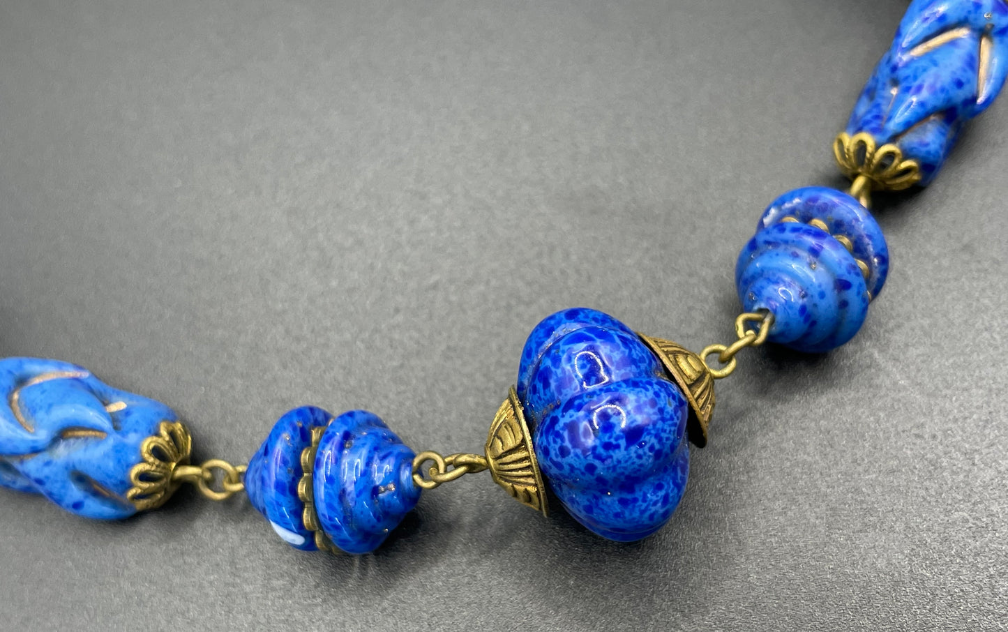 Vintage Art Deco Czech blue faux lapis lazuli glass bead necklace with beautiful moulded glass beads and gold tone filigree