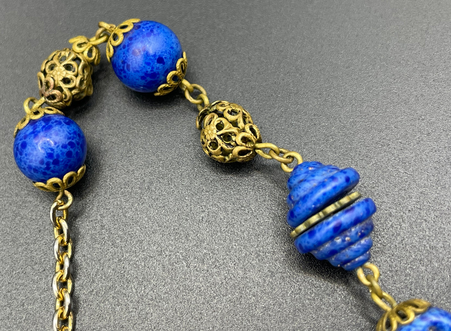 Vintage Art Deco Czech blue faux lapis lazuli glass bead necklace with beautiful moulded glass beads and gold tone filigree