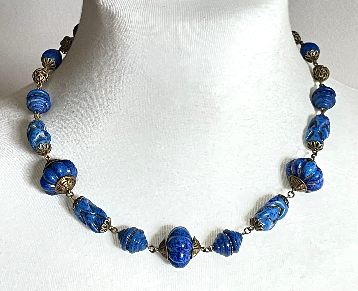 Vintage Art Deco Czech blue faux lapis lazuli glass bead necklace with beautiful moulded glass beads and gold tone filigree