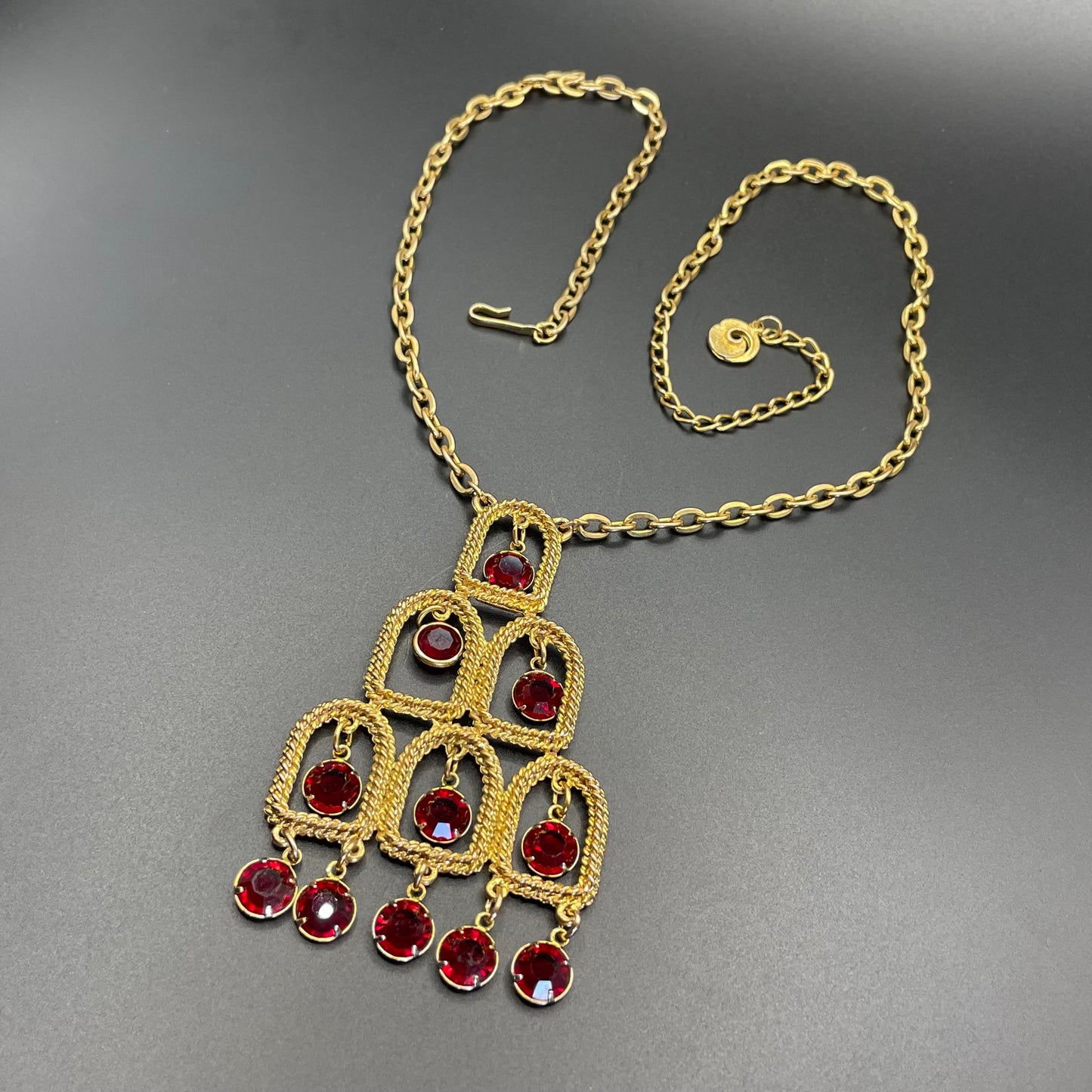 Vintage signed Lisner 1970s long gold tone and ruby red rhinestone chandelier pendant disco necklace and clip on earrings set