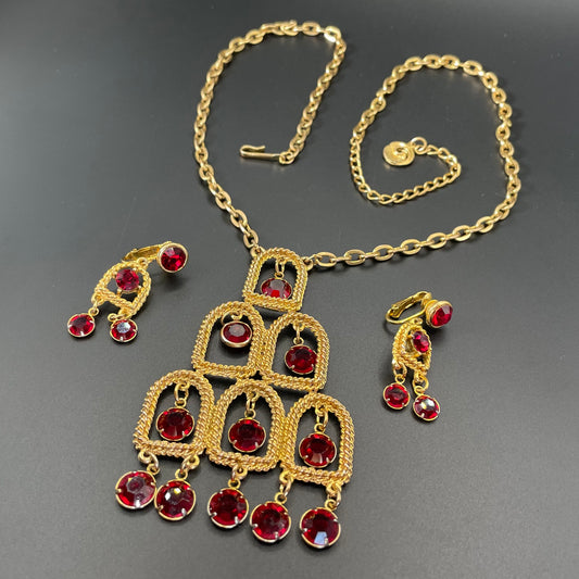 Vintage signed Lisner 1970s long gold tone and ruby red rhinestone chandelier pendant disco necklace and clip on earrings set