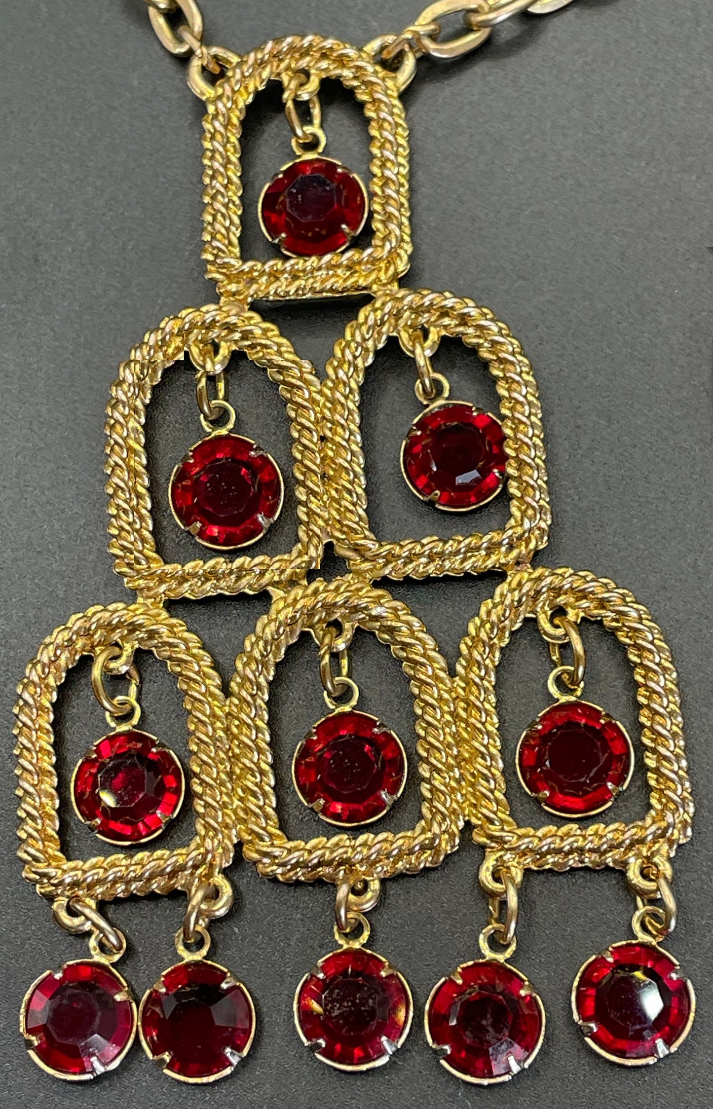 Vintage signed Lisner 1970s long gold tone and ruby red rhinestone chandelier pendant disco necklace and clip on earrings set