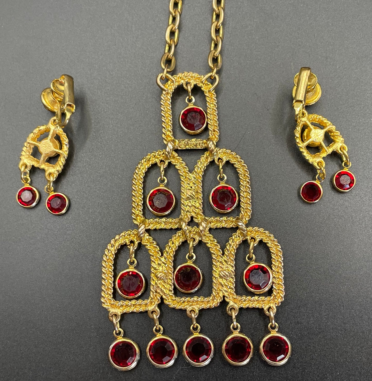 Vintage signed Lisner 1970s long gold tone and ruby red rhinestone chandelier pendant disco necklace and clip on earrings set