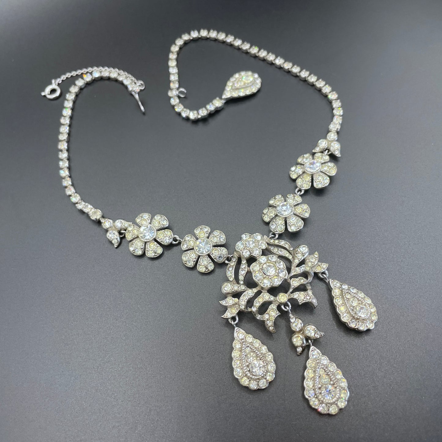 Vintage unsigned Attwood & Sawyer baroque style, ornate rhinestone necklace and matching clip on earrings, encrusted with clear rhinestones