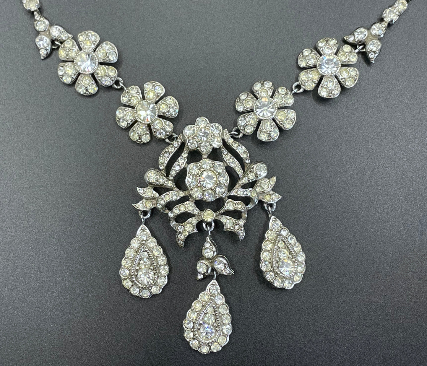 Vintage unsigned Attwood & Sawyer baroque style, ornate rhinestone necklace and matching clip on earrings, encrusted with clear rhinestones