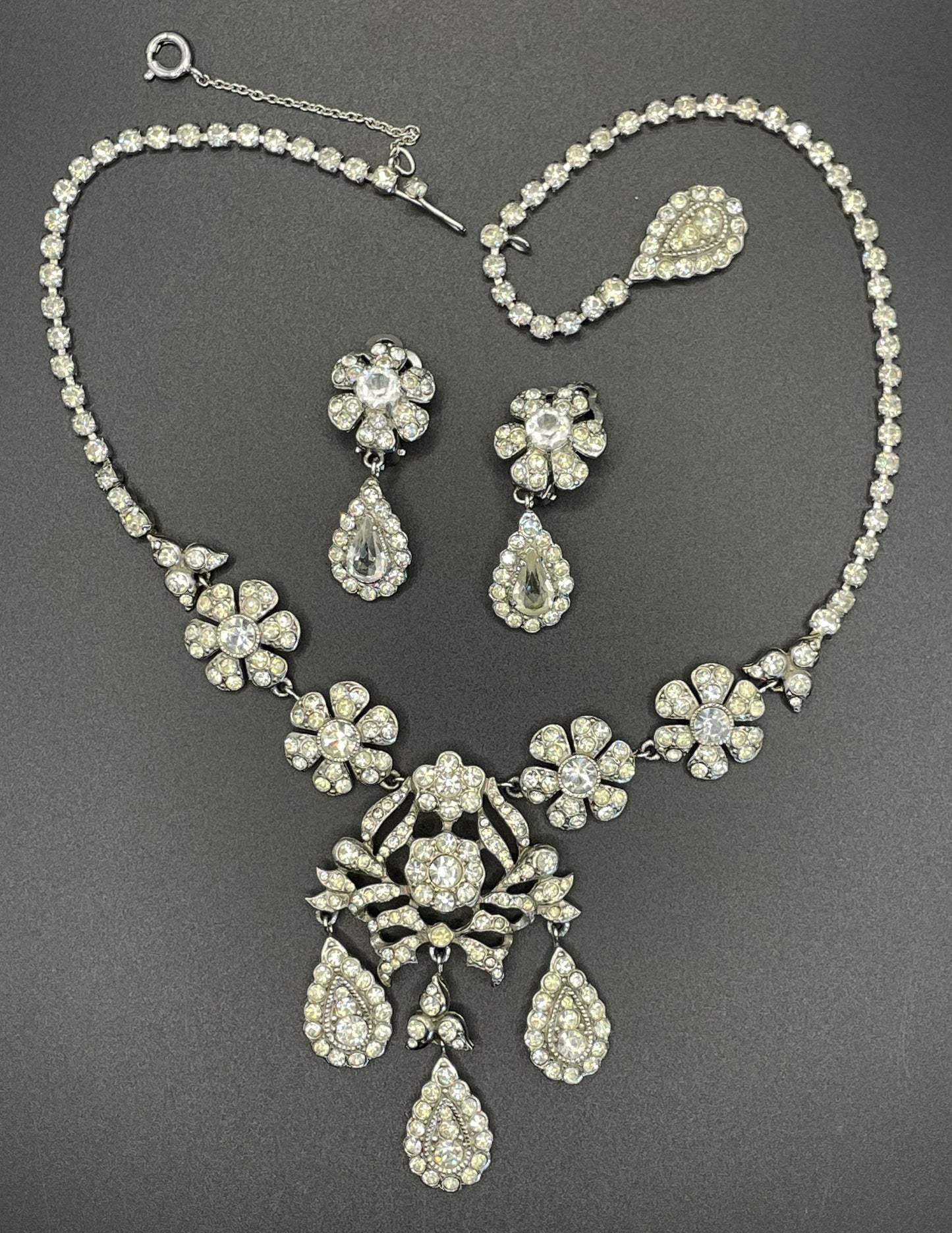 Vintage unsigned Attwood & Sawyer baroque style, ornate rhinestone necklace and matching clip on earrings, encrusted with clear rhinestones