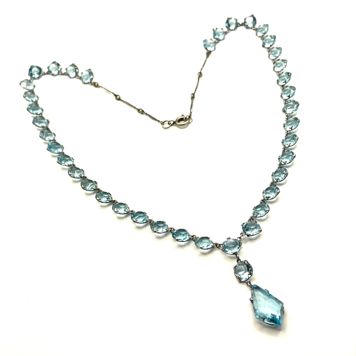 Vintage Art Deco light sapphire blue paste riviere necklace with crystal drop, bezel set open backed stones set in silver tone