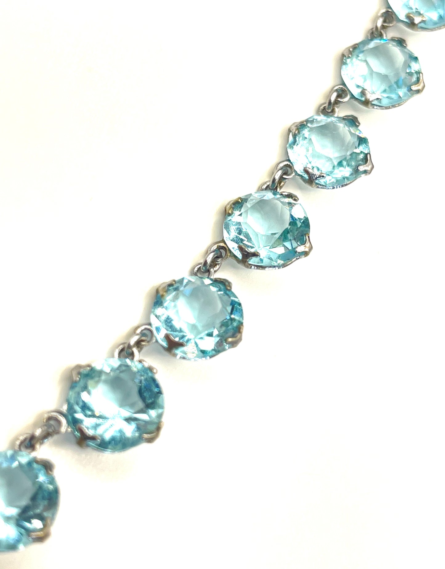 Vintage Art Deco light sapphire blue paste riviere necklace with crystal drop, bezel set open backed stones set in silver tone