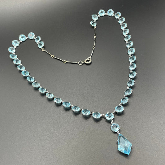 Vintage Art Deco light sapphire blue paste riviere necklace with crystal drop, bezel set open backed stones set in silver tone
