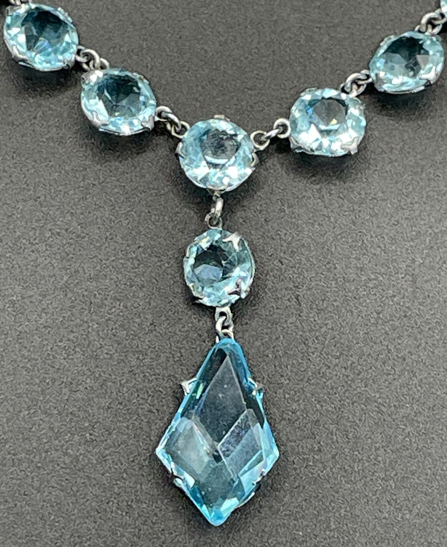 Vintage Art Deco light sapphire blue paste riviere necklace with crystal drop, bezel set open backed stones set in silver tone