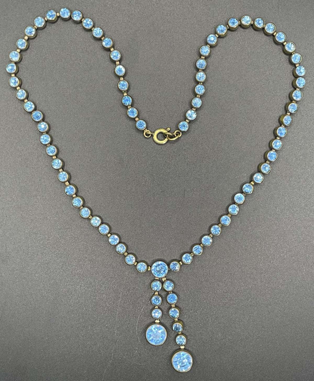 Vintage Art Deco sapphire blue paste riviere necklace with collet set rhinestones set in antique gold tone & asymmetric negligee strands