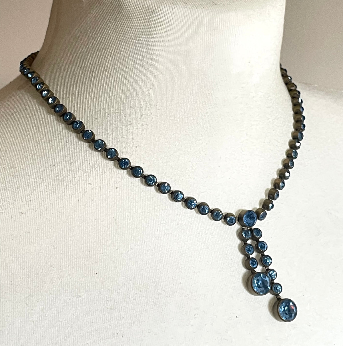 Vintage Art Deco sapphire blue paste riviere necklace with collet set rhinestones set in antique gold tone & asymmetric negligee strands