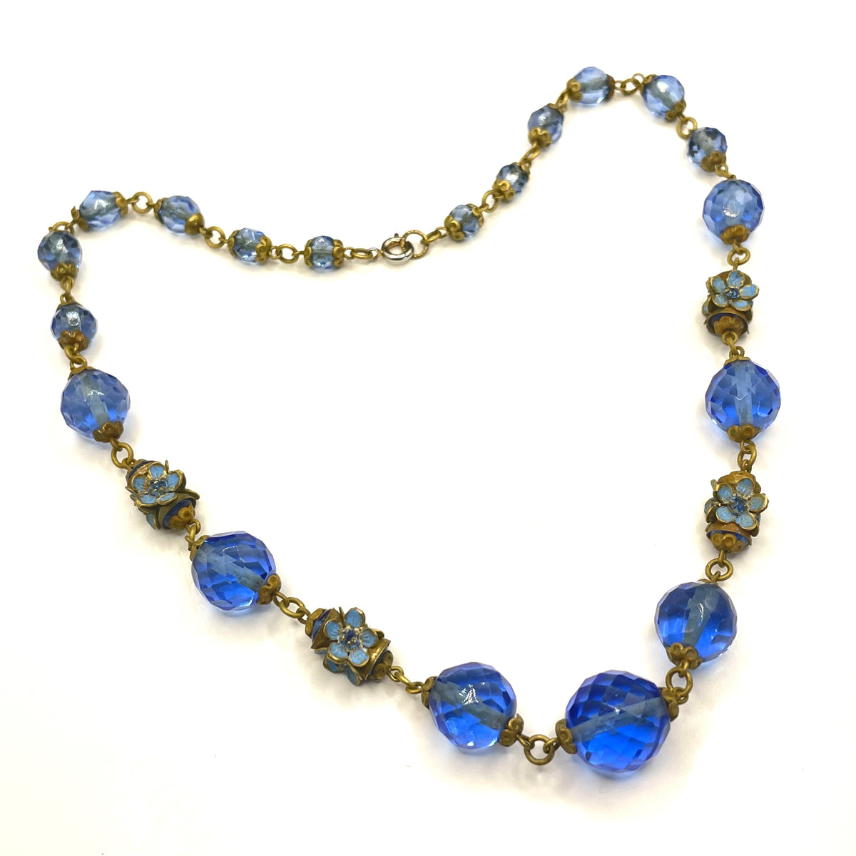 Vintage Art Deco faceted sapphire blue glass bead and rhinestone Czech necklace with beautiful gold tone and enamel painted floral features