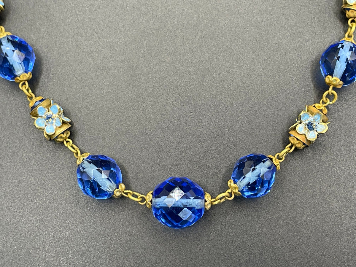 Vintage Art Deco faceted sapphire blue glass bead and rhinestone Czech necklace with beautiful gold tone and enamel painted floral features