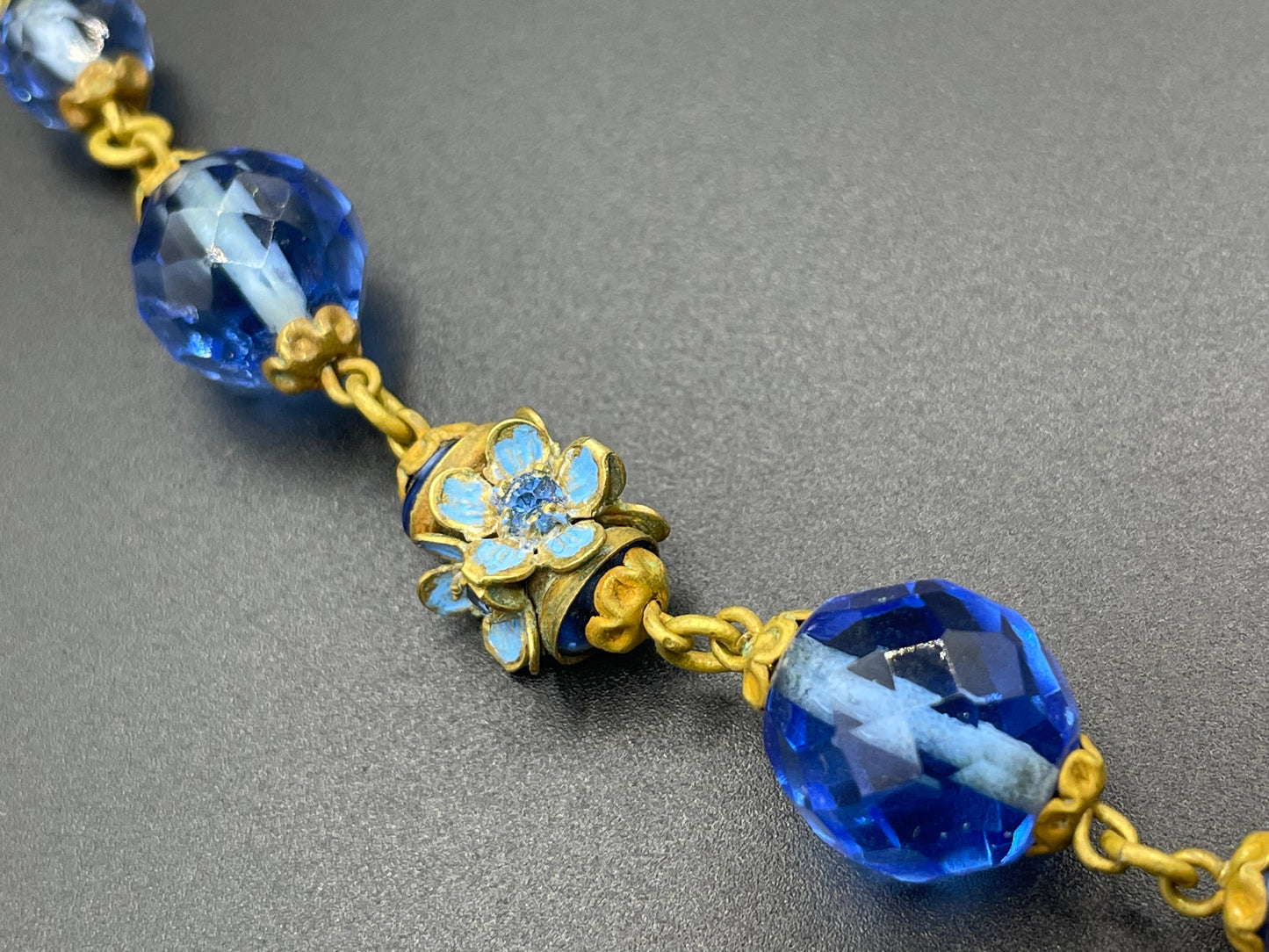 Vintage Art Deco faceted sapphire blue glass bead and rhinestone Czech necklace with beautiful gold tone and enamel painted floral features