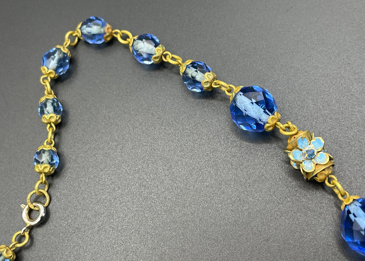 Vintage Art Deco faceted sapphire blue glass bead and rhinestone Czech necklace with beautiful gold tone and enamel painted floral features