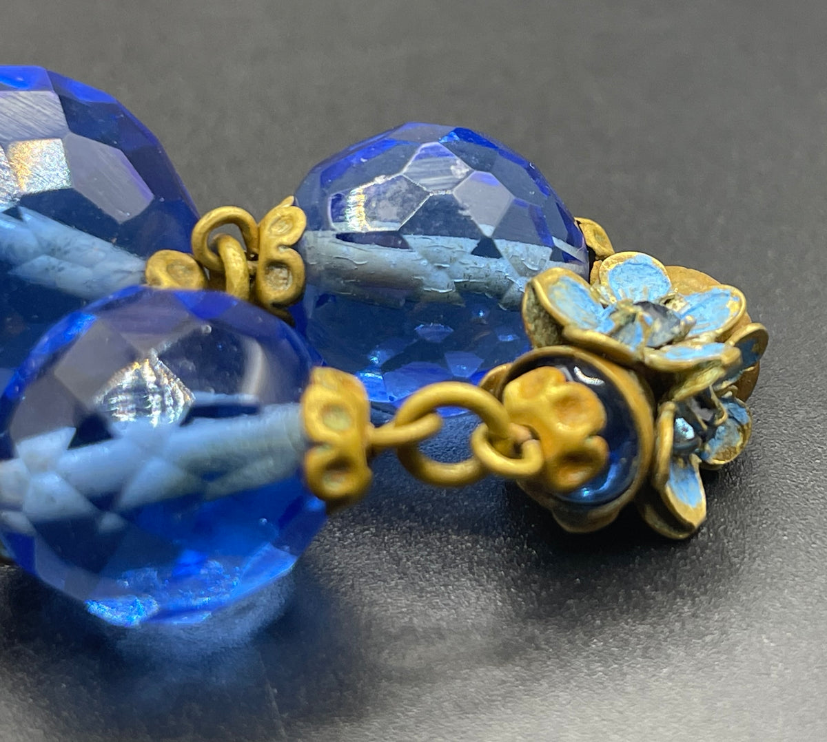 Vintage Art Deco faceted sapphire blue glass bead and rhinestone Czech necklace with beautiful gold tone and enamel painted floral features