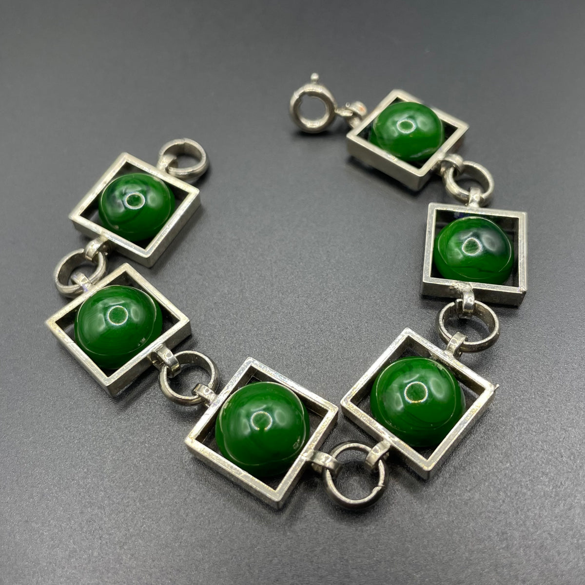 Vintage Art Deco Bauhaus machine age geometric silver tone chrome panel bracelet with glowing green banded glass cabochons, size small