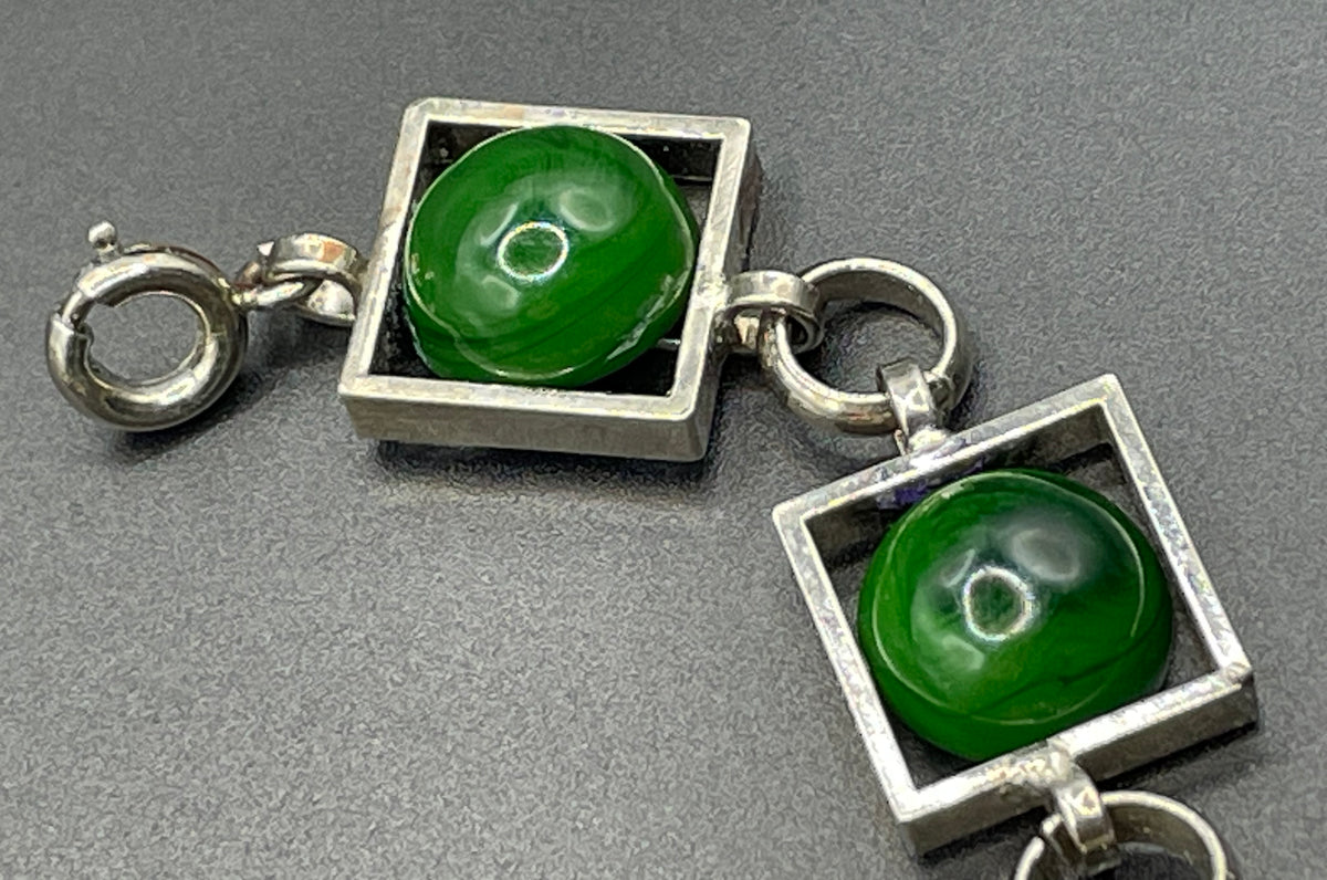 Vintage Art Deco Bauhaus machine age geometric silver tone chrome panel bracelet with glowing green banded glass cabochons, size small