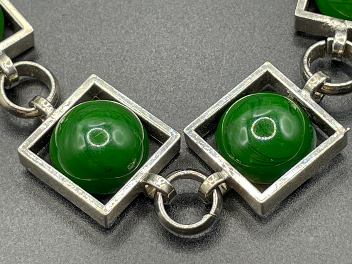 Vintage Art Deco Bauhaus machine age geometric silver tone chrome panel bracelet with glowing green banded glass cabochons, size small