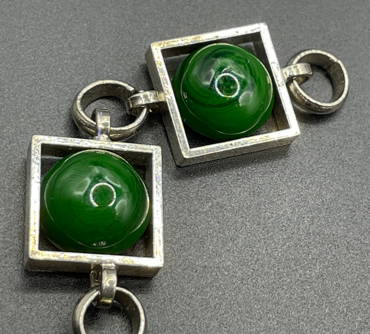 Vintage Art Deco Bauhaus machine age geometric silver tone chrome panel bracelet with glowing green banded glass cabochons, size small