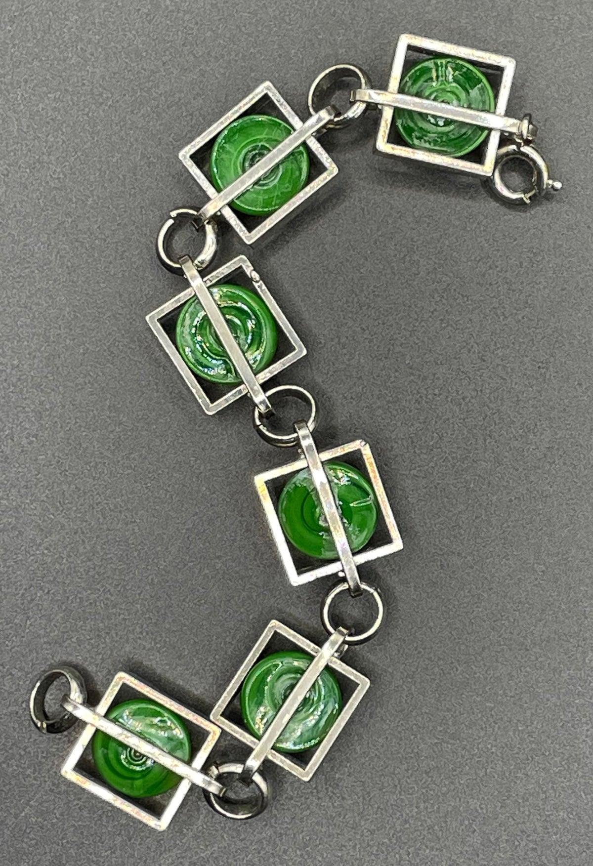 Vintage Art Deco Bauhaus machine age geometric silver tone chrome panel bracelet with glowing green banded glass cabochons, size small