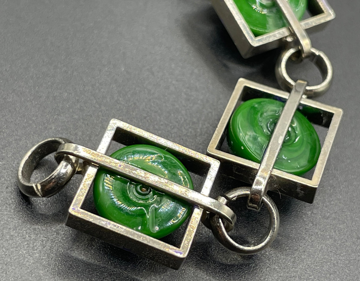 Vintage Art Deco Bauhaus machine age geometric silver tone chrome panel bracelet with glowing green banded glass cabochons, size small