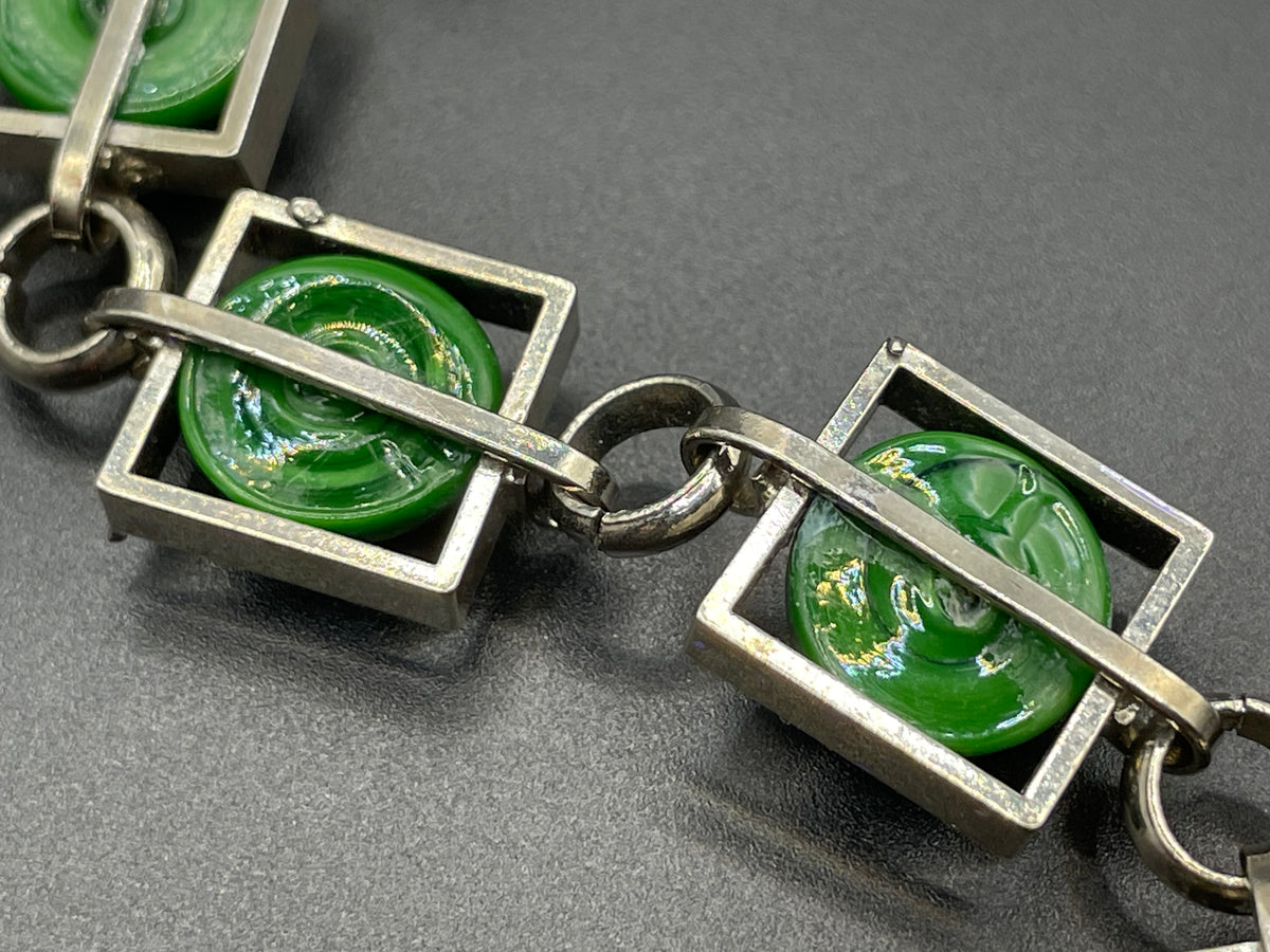 Vintage Art Deco Bauhaus machine age geometric silver tone chrome panel bracelet with glowing green banded glass cabochons, size small
