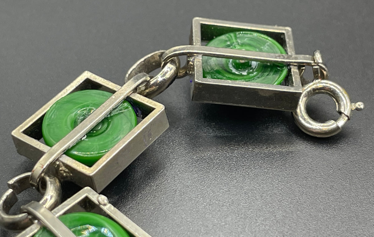 Vintage Art Deco Bauhaus machine age geometric silver tone chrome panel bracelet with glowing green banded glass cabochons, size small