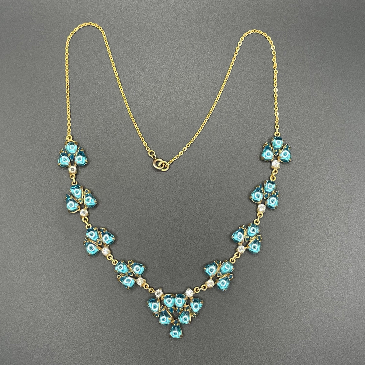 Vintage aqua blue glass cabochon, clear rhinestone and gold tone Y-shaped necklace, beautiful piece