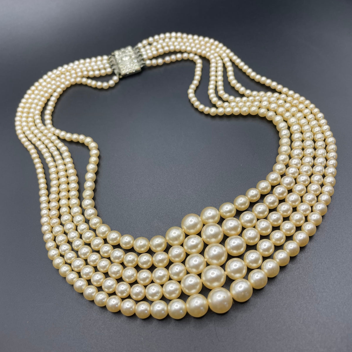 Vintage five strand glass faux pearl necklace with ornate clear rhinestone box clasp, graduated glass pearls