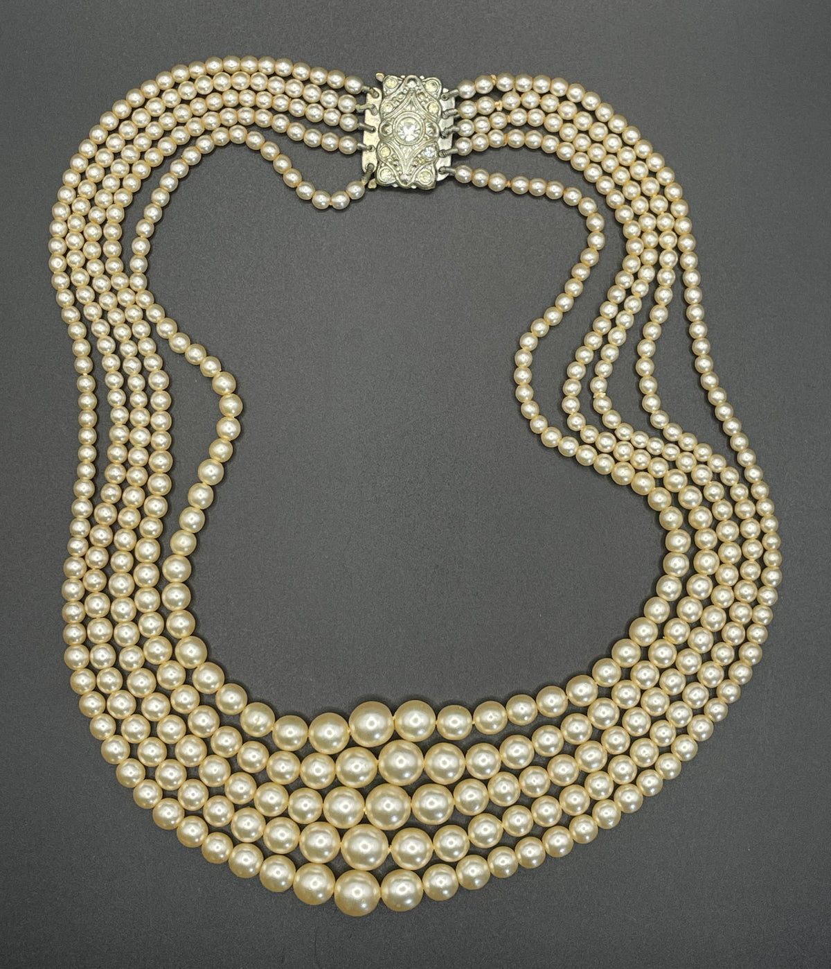 Vintage five strand glass faux pearl necklace with ornate clear rhinestone box clasp, graduated glass pearls